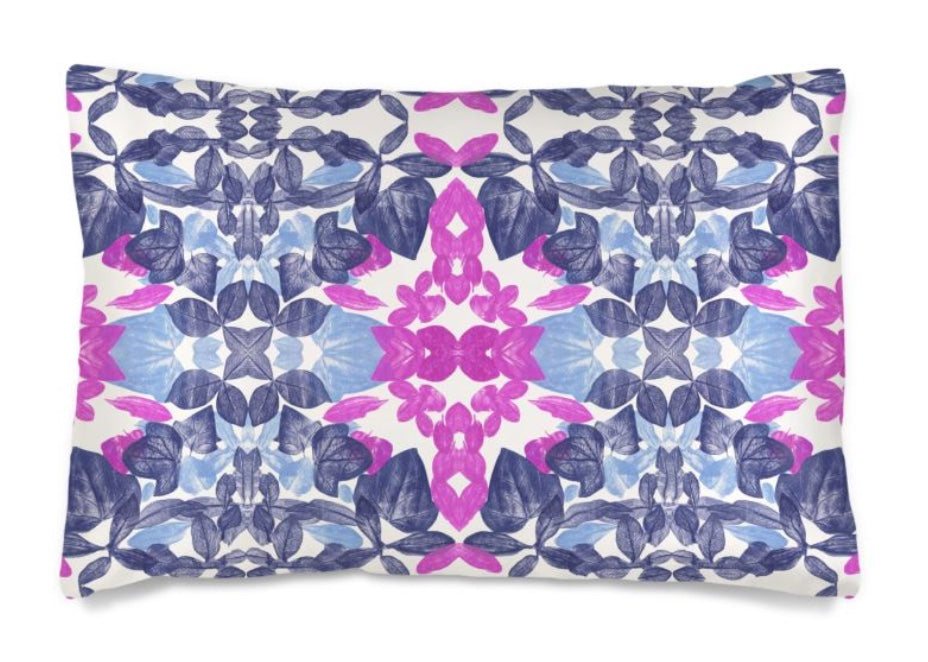 rectangular pillow with a leaf pattern in pink and blue colors